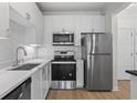 Modern kitchen featuring stainless steel appliances and sleek countertops at 401 16Th Nw St # 1357, Atlanta, GA 30363