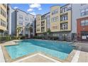 Apartment complex with a well-maintained outdoor pool surrounded by lounge chairs at 401 16Th Nw St # 1357, Atlanta, GA 30363