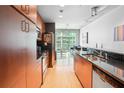 Modern kitchen featuring sleek cabinets, stainless steel appliances, and a breakfast bar at 943 Peachtree Ne St # 902, Atlanta, GA 30309