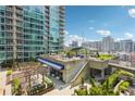 Stunning rooftop deck area with city views, seating and dining areas for entertaining at 943 Peachtree Ne St # 902, Atlanta, GA 30309