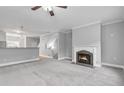 Bright living room with a decorative fireplace and neutral walls at 3044 Lauren Parc Rd, Decatur, GA 30032