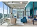 Cozy living room with plush seating, modern lighting, and expansive windows at 943 Peachtree Ne St # 814, Atlanta, GA 30309