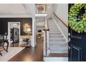 Elegant foyer featuring hardwood floors, staircase, and a view into the living spaces at 200 Mystic Ct, Atlanta, GA 30342