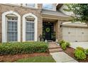 Inviting front entrance with brick steps, decorative wreath on door, and manicured bushes at 200 Mystic Ct, Atlanta, GA 30342