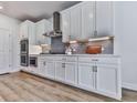 Gourmet kitchen featuring modern appliances, sleek cabinetry, and stylish tile backsplash at 449 Carmichael Cir, Canton, GA 30115