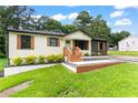 Well-maintained single-story home with lawn, newly painted exterior and welcoming front entrance at 1326 Stella Sw Cir, Mableton, GA 30126