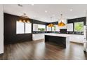 Gourmet kitchen with black backsplash, marble island and countertops, and stainless steel appliances at 2220 Meadowvale Ne Dr, Atlanta, GA 30345