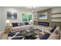Inviting living room with a cozy fireplace, stylish decor, and ample natural light at 3160 Ann Se Rd, Smyrna, GA 30080