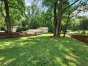 Large backyard with privacy fence and lush greenery at 4798 Mary Dale Ct, Lilburn, GA 30047