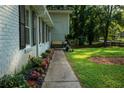 A welcoming walkway lined with lush flowers leads to the home at 4798 Marydale Sw Ct, Lilburn, GA 30047