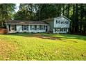 Charming two-story home with black shutters and a spacious front yard at 4798 Marydale Sw Ct, Lilburn, GA 30047