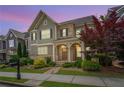 Charming two-story home boasts a stone and siding exterior with a welcoming front porch and landscaped yard at 238 Avery Ne St, Marietta, GA 30060