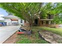 View of home with lawn, driveway, a white garage and porch swing on the side at 2711 Bethesda Ne Ct, Lawrenceville, GA 30044