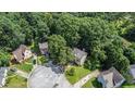 Aerial view of a cul-de-sac featuring a home with a large, tree-filled private backyard at 3440 Oaktree Way, Stonecrest, GA 30038