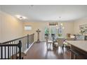 Upstairs Dining room with hardwood floors, chandelier, and natural light from the patio doors at 1066 Brandsford Nw St, Atlanta, GA 30318