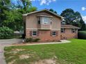 Charming brick home with a well-maintained lawn and inviting curb appeal at 2206 Rhett Ct, Lawrenceville, GA 30044