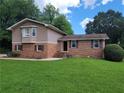 Charming brick home with a well-maintained lawn and inviting curb appeal at 2206 Rhett Ct, Lawrenceville, GA 30044