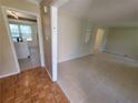 Spacious living room with neutral tile floors connecting to the kitchen at 2206 Rhett Ct, Lawrenceville, GA 30044