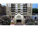 Striking exterior of Park Towers featuring lush landscaping and inviting entrance at 795 Hammond Dr # 506, Sandy Springs, GA 30328