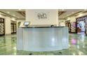 Clean and inviting lobby featuring a reception desk, tiled floor and ornate doors at 795 Hammond Dr # 506, Sandy Springs, GA 30328