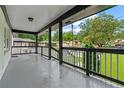 Covered front porch offers great views of the neighborhood and has painted black and white accents at 2266 Kennedy Nw Ct, Atlanta, GA 30318