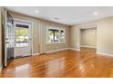 Bright living room boasts refinished hardwood floors and a large window for lots of natural light at 2266 Kennedy Nw Ct, Atlanta, GA 30318