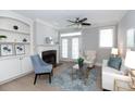 Cozy living room with fireplace, built-in shelves, and large windows for natural light at 4810 Ivy Ridge Se Dr # 303, Atlanta, GA 30339