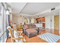 Spacious living room and kitchen area with bar seating and stainless steel appliances at 171 Auburn Ne Ave # 521, Atlanta, GA 30303
