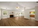 Bright and airy living room with hardwood floors, fireplace, and French doors to the backyard at 2109 Tranquility Ct, Woodstock, GA 30188