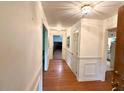 Inviting entryway with hardwood floors, white wainscoting and decorative light fixtures at 1333 Council Bluff Ne Dr, Atlanta, GA 30345