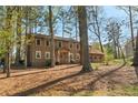 Exterior shot of two story home with neutral siding, a covered front porch, and two car garage at 4354 Revere Cir, Marietta, GA 30062