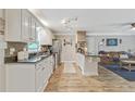 Spacious kitchen with granite counters, stainless steel appliances and hardwood floors flowing into the living area at 3605 Hickory Se Cir, Smyrna, GA 30080