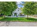 Charming cottage-style home with landscaped lawn, patio, and black trim windows and doors at 439 Atlanta Se Ave, Atlanta, GA 30315