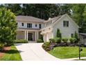 Charming two-story home boasts a two-car garage and landscaped yard at 633 Channing Nw Dr, Atlanta, GA 30318