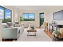 Inviting living room boasts natural light, comfortable seating, and scenic views through large windows at 795 Hammond Dr # 808, Sandy Springs, GA 30328