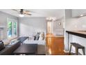 Bright living room with a fireplace, ceiling fan, and access to a balcony at 903 Tuxworth Cir, Decatur, GA 30033