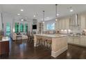 Spacious open-concept kitchen with a large island, modern appliances, and plenty of seating at 3467 Brookleigh Ne Ln, Atlanta, GA 30319