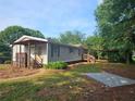 Quaint home with a covered front porch, carport, and well-maintained lawn at 400 Old Stagecoach Rd, Carrollton, GA 30116