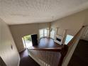 An aerial view of a living room with a fireplace and large windows at 312 Yarbrough Ct, Dacula, GA 30019
