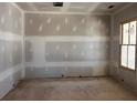 Unfinished bedroom with a large window with exterior brick view at 2759 S Waterworks Rd, Buford, GA 30518