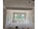 Unfinished living room featuring a large window set and great natural light at 2759 S Waterworks Rd, Buford, GA 30518