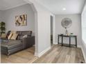 Bright living room with gray walls, light wood floors, and modern decor at 752 Sw Cooper St Sw, Atlanta, GA 30315