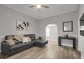 Inviting living room with a contemporary sofa, stylish decor, and neutral tones at 752 Sw Cooper St Sw, Atlanta, GA 30315