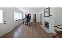 Cozy living room with white walls, fireplace, and hardwood floors at 167 Garden Ln, Decatur, GA 30030