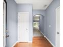 Bright hallway with hardwood floors, archway, and neutral paint, creating a welcoming entry at 2776 Snapfinger Mnr # 2776, Decatur, GA 30035