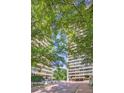 Exterior shot of Plaza Towers condominium buildings entrance and landscaping at 2575 Peachtree Ne Rd # 15F, Atlanta, GA 30305