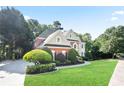Charming brick home with well-maintained lawn, showcasing its inviting facade and neighborhood setting at 3741 Cape York Trce, Alpharetta, GA 30022