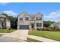 Charming painted brick home with an attached garage, landscaping, and a welcoming front porch and doorway at 610 Brickstone Ct, Covington, GA 30016