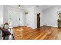 Spacious foyer featuring hardwood floors, decorative inlay, and traditional accents at 1920 Daves Creek Trl, Cumming, GA 30041