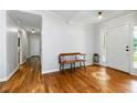 Inviting foyer with hardwood floors and a decorative sunflower inlay at 1920 Daves Creek Trl, Cumming, GA 30041